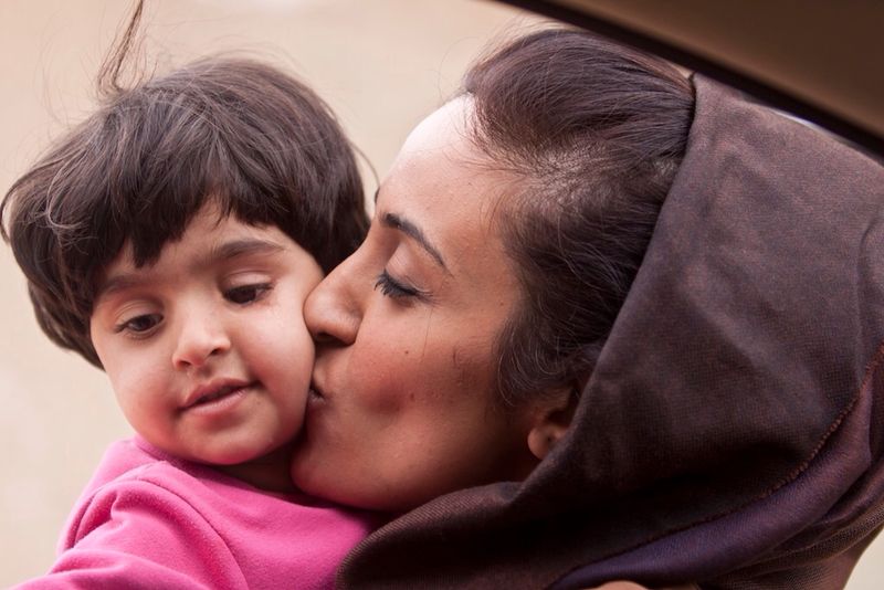 Muna Harib with refugee child