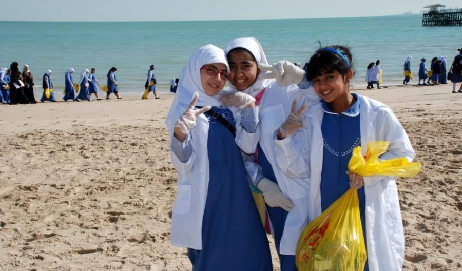 Girls clean up beach
