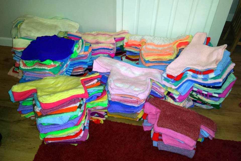 Sweaters knitted for Syrians by Doris of Swindon, UK