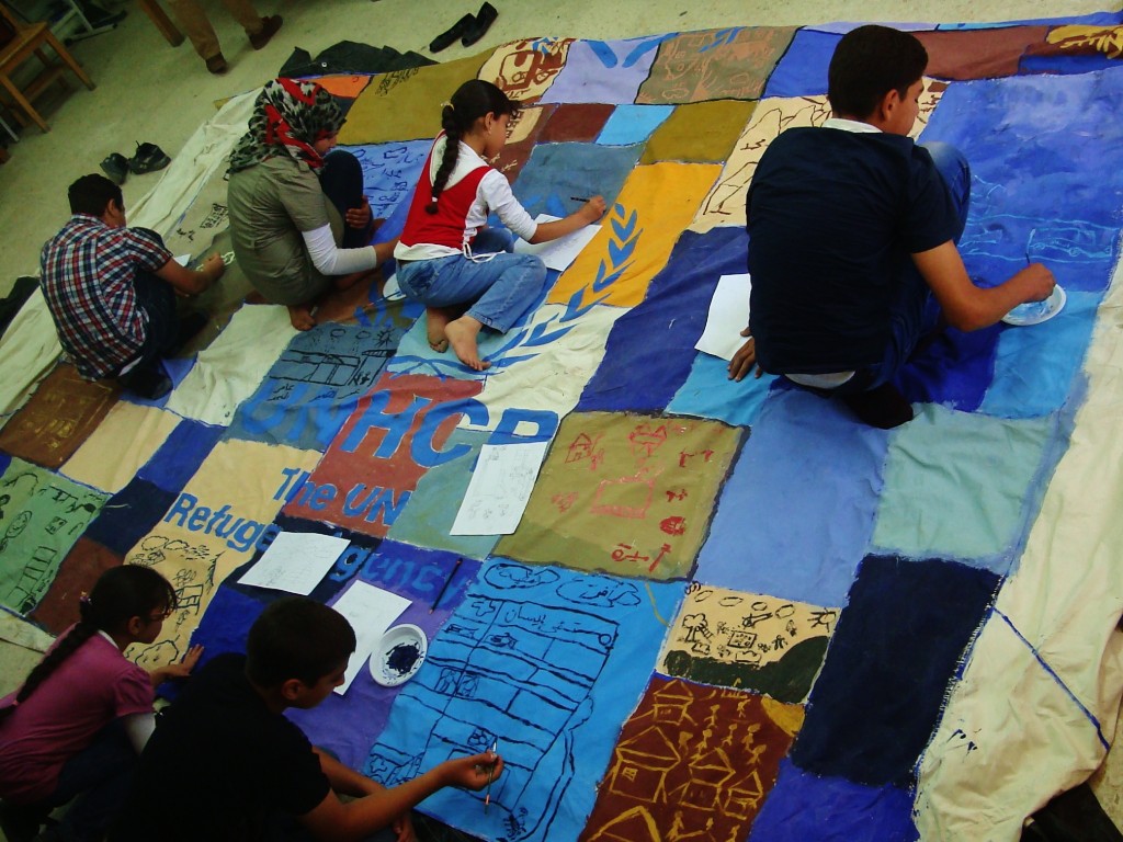 UNHCR Children making rug
